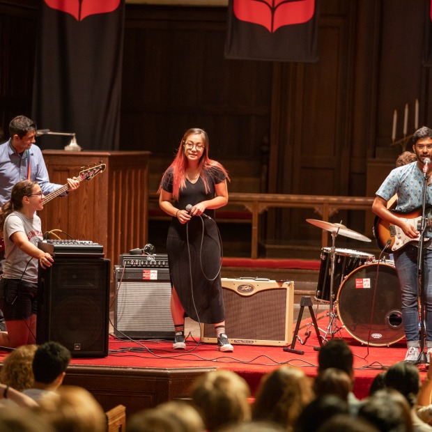 students perform on stage