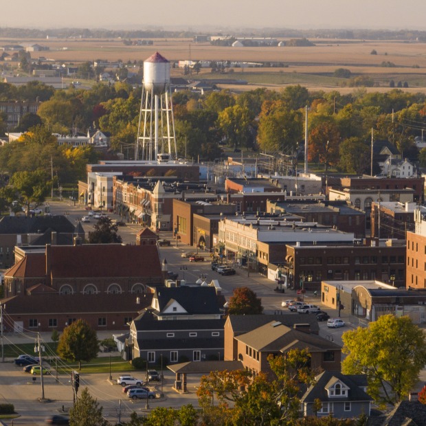 A bird's-eye view of downtown Grinnell with an old-style water tower