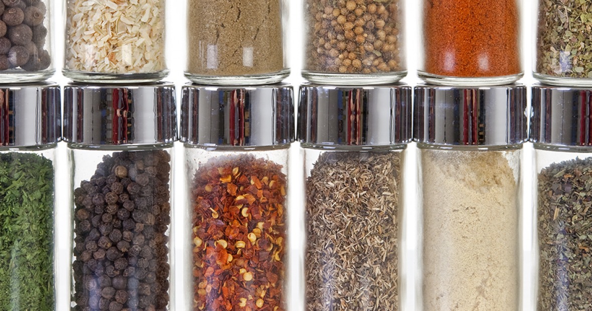 row of spices in small, clear glass jars